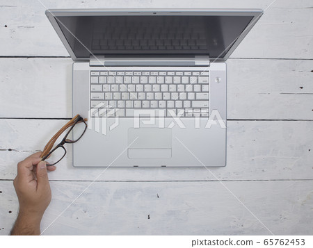top view man useing Laptop computer top view man useing Laptop computer 65762453