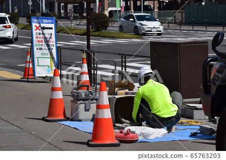 Pavement work on a sidewalk Pavement work on a sidewalk 65763203