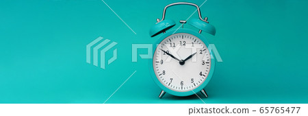 Modern alarm clock turquoise closeup object Modern alarm clock turquoise closeup object 65765477