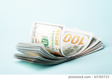 Pack of money on blue background. Pack of money on blue background. 65765715