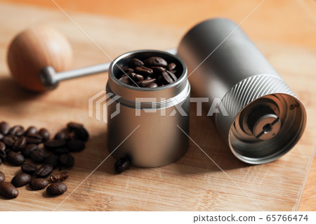 Modern manual coffee grinder and roasted coffee Modern manual coffee grinder and roasted coffee 65766474