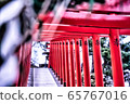 Traditional Japanese red Torii gates at the entrance of an Inari Shinto shrine in Hokkaido. 65767016