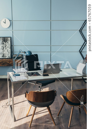 Empty workspace. Work table with laptop and chairs. 65767059