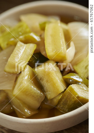 Cucumber and onion pickled in omaji oil Cucumber and onion pickled in omaji oil 65767062