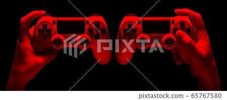 Set of hands holding video game gamepad in neon Set of hands holding video game gamepad in neon 65767580