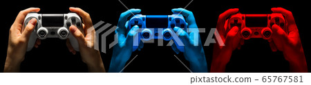 Set of hands holding video game gamepad in neon Set of hands holding video game gamepad in neon 65767581