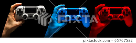 Set of hands holding video game gamepad in neon Set of hands holding video game gamepad in neon 65767582