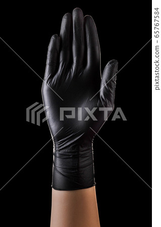 Hand in black gloves showing five fingers and palm Hand in black gloves showing five fingers and palm 65767584