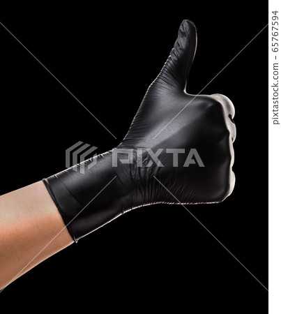 Hand in black glove showing gesture of like sign, Hand in black glove showing gesture of like sign, 65767594