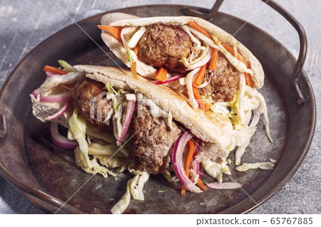 Meatballs with cabbage in pita 65767885