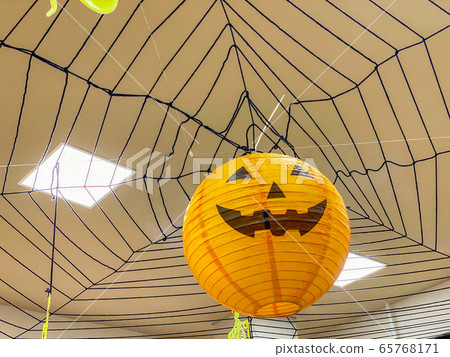 Orange jack o lantern with spooky smile for Halloween decoration Orange jack o lantern with spooky smile for Halloween decoration 65768171