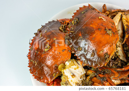Stir-fried crab with garlic and salt pepper on white plate Stir-fried crab with garlic and salt pepper on white plate 65768181