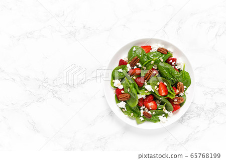 Fresh spinach salad with strawberry, pine and Fresh spinach salad with strawberry, pine and 65768199