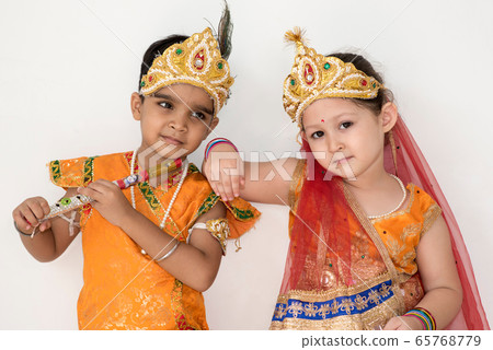 Children dress as Krishna and Radha during the Janmashtami. 65768779
