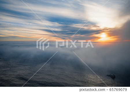 Ocean mist or fog on a beach at sunset. Magnificent aerial view 65769079