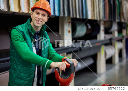young caucasian warehouse worker at workplace 65769222