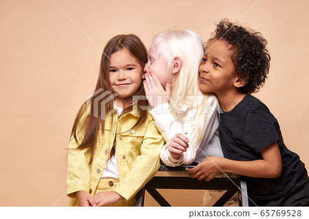 two girlfriends share secret with each other two girlfriends share secret with each other 65769528