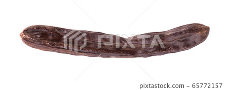 Ripe carob pods and bean isolated on white background. Ripe carob pods and bean isolated on white background. 65772157