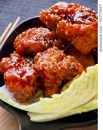 Fried seasoned chicken and cabbage 65774457