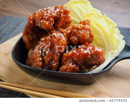 Fried seasoned chicken and cabbage Fried seasoned chicken and cabbage 65774470