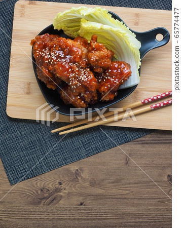 Fried seasoned chicken and cabbage Fried seasoned chicken and cabbage 65774477
