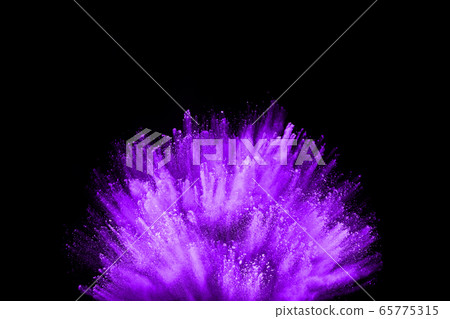 The movement of abstract dust explosion frozen purple on black background. Stop the movement of powdered purple on black background. Explosive powder purple on black background. 65775315