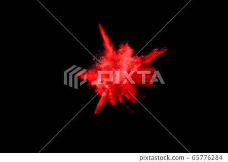 abstract red powder explosion on black background.abstract red powder splatted on black background. Freeze motion of red powder exploding. 65776284