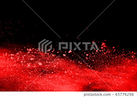 abstract red powder explosion on black background.abstract red powder splatted on black background. Freeze motion of red powder exploding. 65776298
