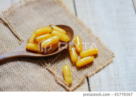 Yellow capsule medicine or supplementary food from Yellow capsule medicine or supplementary food from 65776567