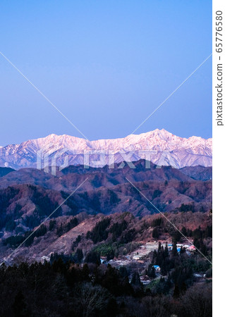 Early winter Northern Alps and Gotateyama mountain range seen from Ogawa village (dawn) 65776580
