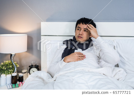 sick man is headache in bed sick man is headache in bed 65777721