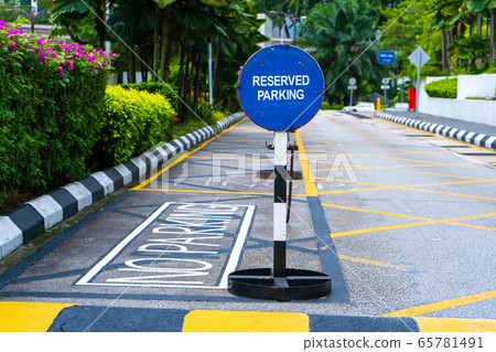 Parking blocked by signs parking reserved close up 65781491