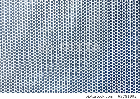 Close up metal plate with many small circular holes Close up metal plate with many small circular holes 65781992