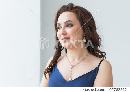 Close-up of woman wearing a Jewelry, bijouterie and accessories. Close-up of woman wearing a Jewelry, bijouterie and accessories. 65782812
