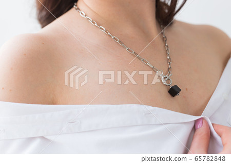 Close-up of woman wearing a Jewelry, bijouterie and accessories. 65782848