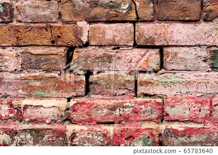 Texture of a brick wall with cracks and scratches 65783640