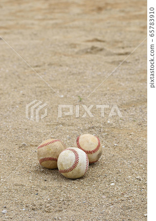Three baseball balls (hardball) placed on the soil Three baseball balls (hardball) placed on the soil 65783910