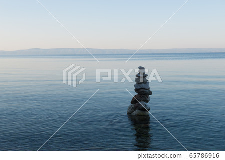 Balance stone pyramid on the sea coast Balance stone pyramid on the sea coast 65786916