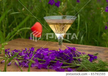 Wine glass against rural landscape, Wine glass against rural landscape, 65791593