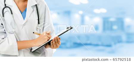 Woman doctor working at the hospital office. 65792518