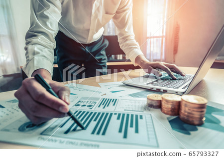 Businessman analyze data of stock market research. 65793327