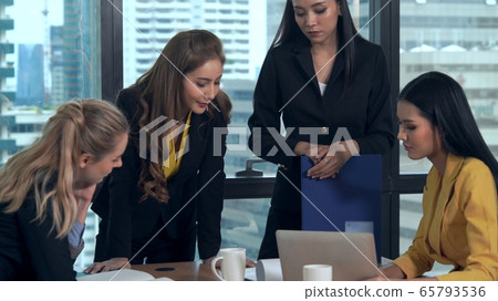 Group meeting of professional businesswomen thinking with new project planning. 65793536