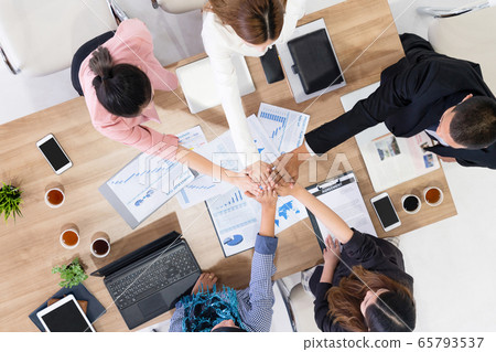 Teamwork business people join hands in meeting. 65793537