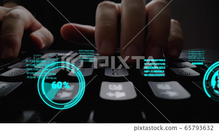 Man working on laptop computer keyboard with graphic user interface GUI hologram 65793632