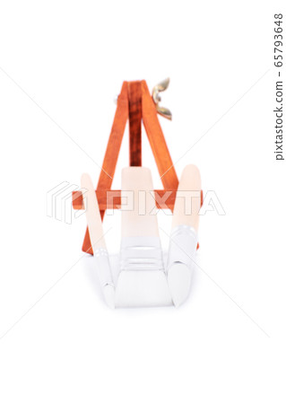 Close up of paint brushes and an easel Close up of paint brushes and an easel 65793648