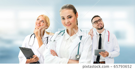 Doctor working in hospital with other doctors. Doctor working in hospital with other doctors. 65793652