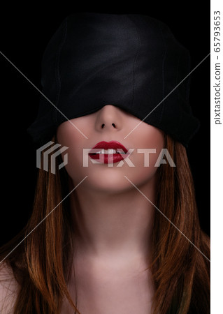 Beautiful blindfolded woman with red lipstick Beautiful blindfolded woman with red lipstick 65793653