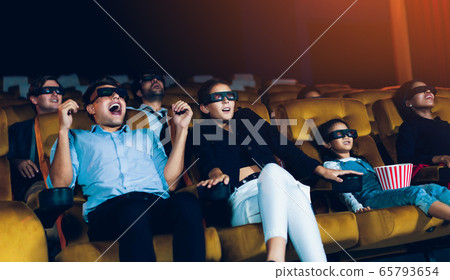 Group of people watch 3d movie in cinema theater Group of people watch 3d movie in cinema theater 65793654