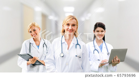 Doctor working in hospital with other doctors. Doctor working in hospital with other doctors. 65793696