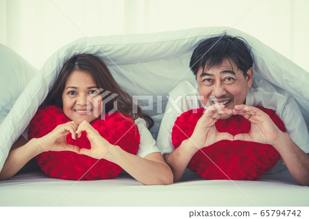 Happy Asian senior people having good time at home 65794742